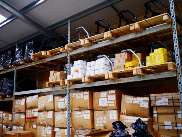 Carver One rear frames stacked in CCPS warehouse
